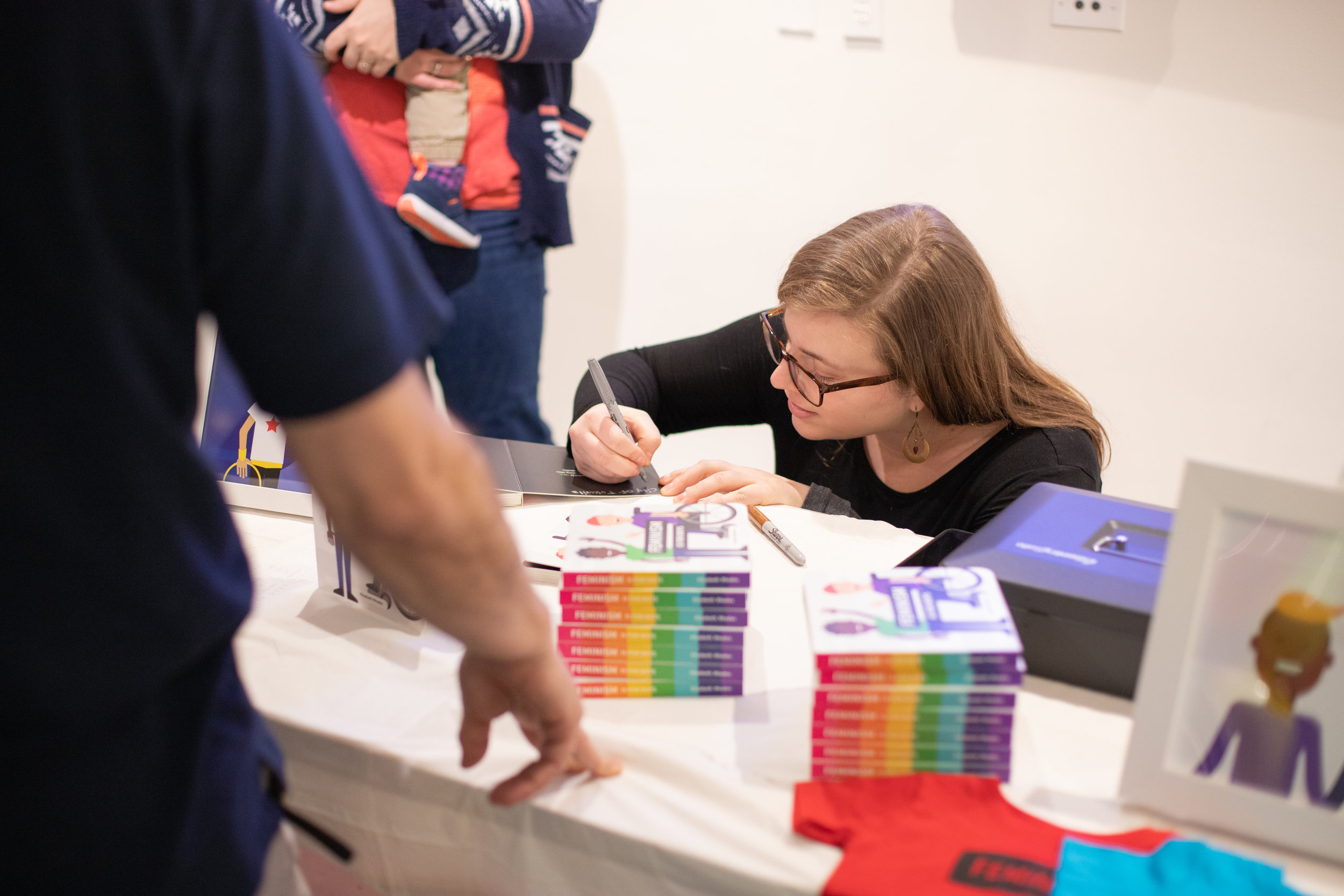 Elizabeth Rhodes signing copies of Feminism is for Boys